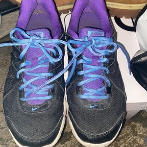Black and purple Nike tennis shoes